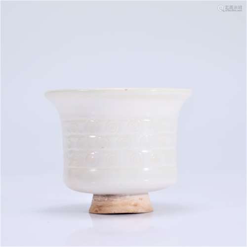 A WHITE GLAZED CUP