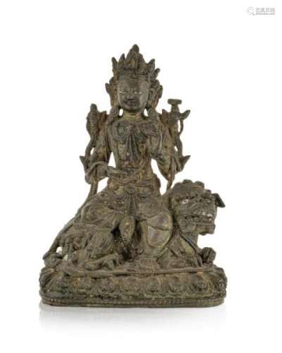 Manjushri assis sur un chien de Fô, sculpture en bronze, Tibet, XIXe s., les mains [...]