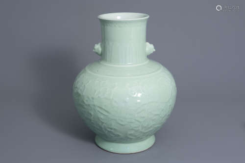 A large Chinese monochrome celadon floral relief decorated vase, Qianlong mark, 19th/20th C.