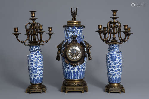 A Chinese three-piece bronze mounted blue and white porcelain garniture, 19th C.