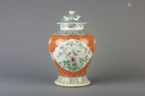 A Chinese famille rose vase and cover with floral design, 19th C.