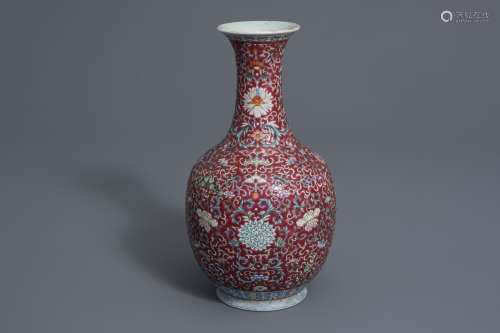 A Chinese famille rose red ground bottle vase, Qianlong mark, 19th/20th C.