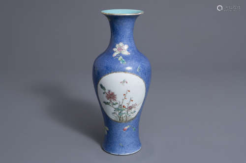 A Chinese famille rose blue ground baluster vase, Qianlong mark, 19th C.