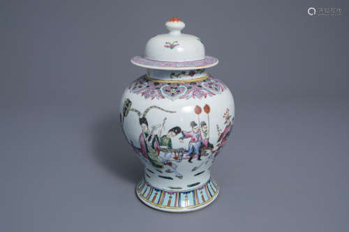 A Chinese famille rose vase and cover with figures in a landscape, 19th C.