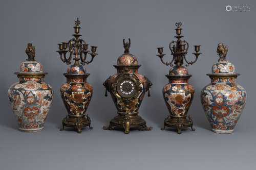 A pair of Japanese Imari vases and covers and a three-piece garniture, Edo/Meiji, 19th C.