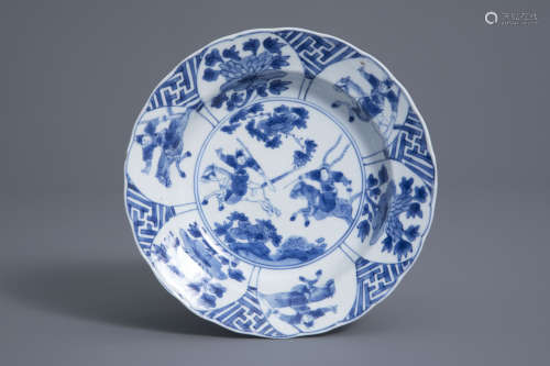 A Chinese blue and white horseriders plate, Kangxi mark and of the period