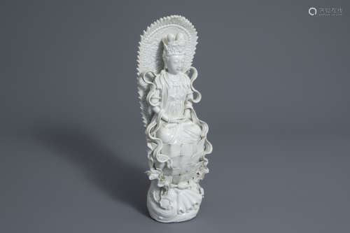 A Chinese Dehua blanc de Chine model of a seated Guanyin, 19th C.