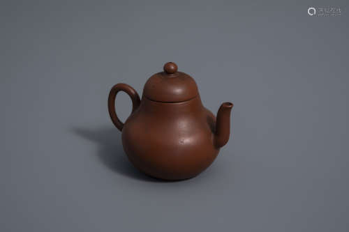 A Chinese Yixing stoneware teapot and cover, 19th C.