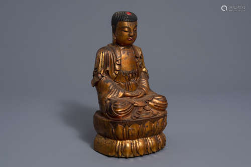 A Chinese gilt lacquered wood figure of Buddha, 18th/19th C.