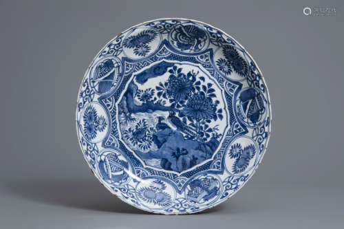 A large Chinese blue and white kraak porcelain charger with birds among blossoming branches, Wanli