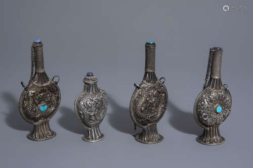 Four Tibetan turquoise and lapiz lazuli mounted silver snuff bottles, 19th/20th C.