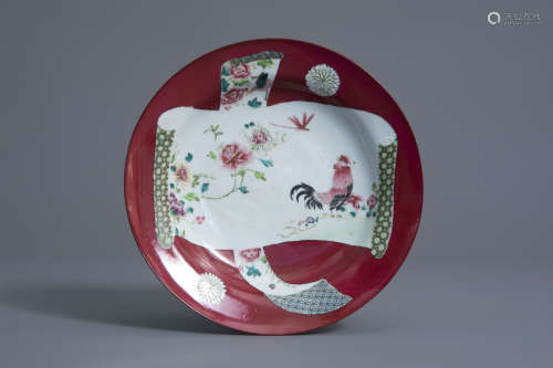 A Chinese famille rose ruby ground rooster plate, 18th/19th C.