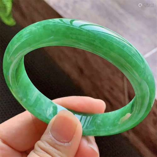 A Chinese Carved Jadeite Bracelet