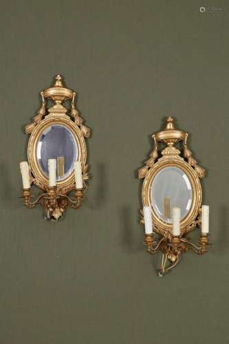 Pair of medallion sconces with mirror back and 3 l…