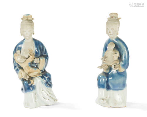 Pair of blue and cream enamelled terracotta statue…