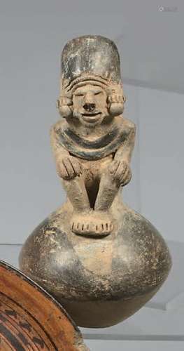 Ceremonial ocarina shaped like a seated chief, han…