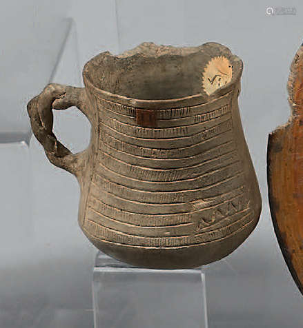Decreasing jug with braided handle, decorated with…