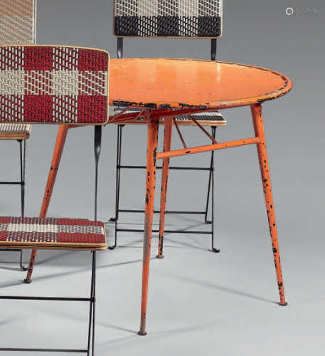 Folding table in orange lacquered sheet metal, the…