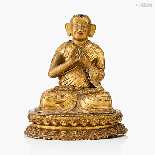 34. A Tibetan/Nepalese Gilt Copper Repoussé Figure of Tsongkhapa