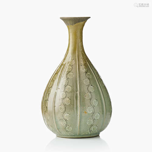 53. A Korean Slip Decorated Celadon Earthenware bottle Vase