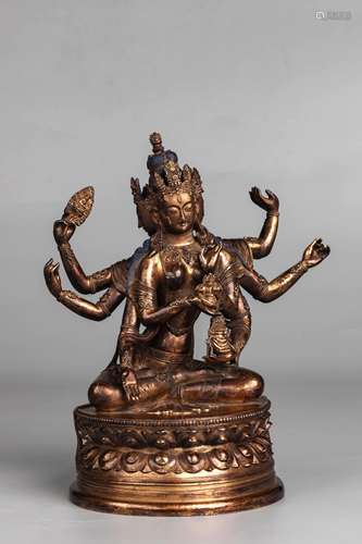 A Gilt Bronze Six Armed Guanyin