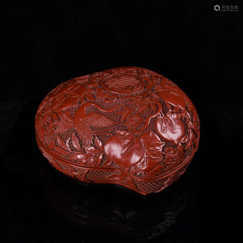 A Carved Cinnabar Peach and Longivity lacquer Box and Cover