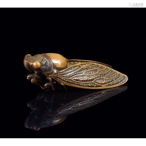 NETSUKE made of natural wood, in the shape of a ci…
