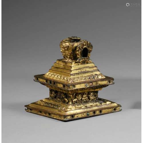 A gilded copper STUPA , resting on a stepped quadr…