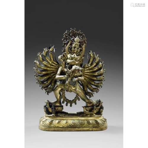 A LARGE STATUETTE OF YAMANTAKA in gilded bronze an…