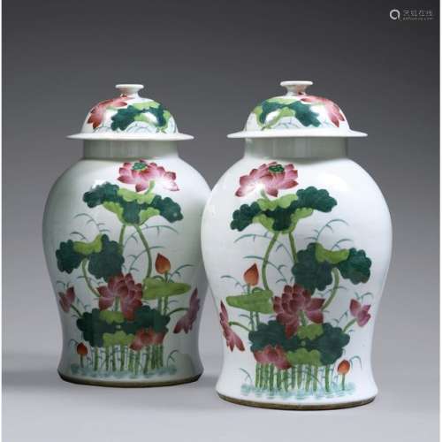 PAIR OF COVERED BALUSTRY JARS in porcelain and pol…