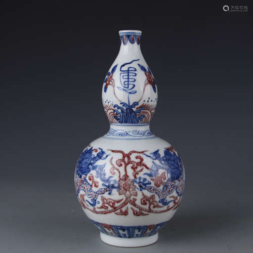 A Kangxi blue and white gourd with red dragon in glaze