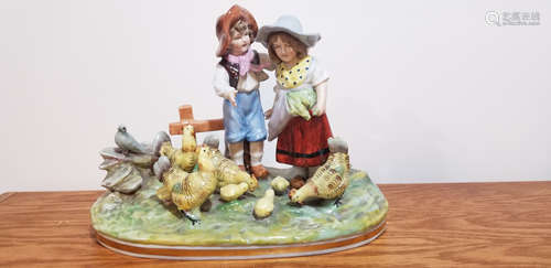 Capodimonte Statue of A Boy and Girl Feeding Chickens.