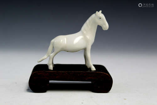 Chinese blanc de chine porcelain horse on wood stand.