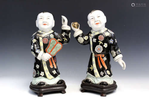 Two Chinese famille rose porcelain figures of boys.