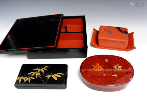 Group of four Japanese lacquer boxes.