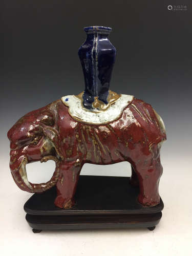 Chinese red glazed porcelain figure of an elephant.