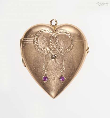 Pendentif porte-photo en forme de cœur serti de deux rubis et d'une rose de diamant [...]