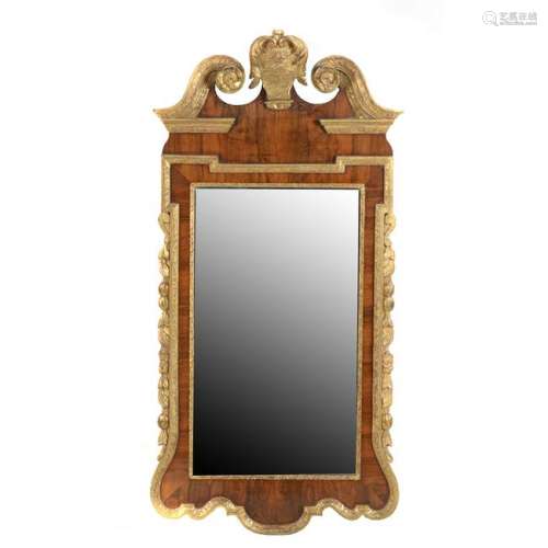 George I Walnut and Parcel Gilt Mirror.