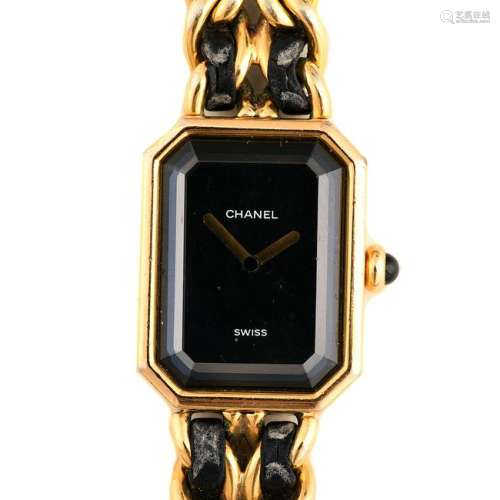 Ladies Chanel Black and Gold-Tone Fashion Wristwatch.