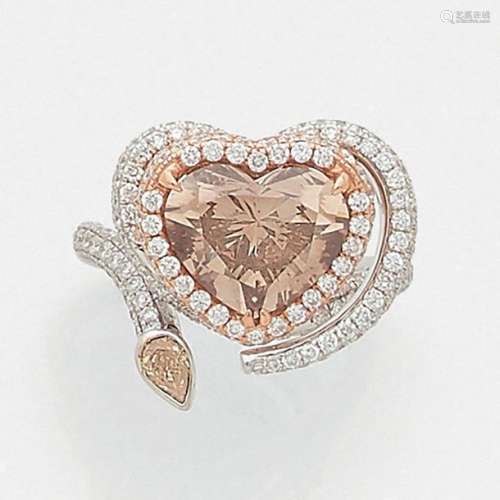 HEART DIAMOND RING is adorned with a Fancy Dark Or…