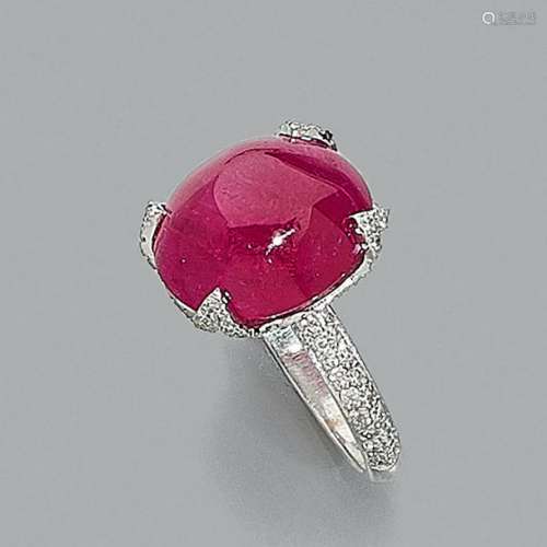 Ruby cabochon ringShe wears an oval ruby cabochon …
