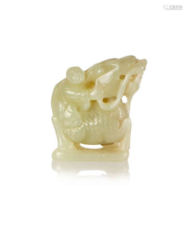A CHINESE CARVED JADE BOY WITH QILIN