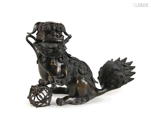 A CHINESE BRONZE BUDDHIST LION-DOG