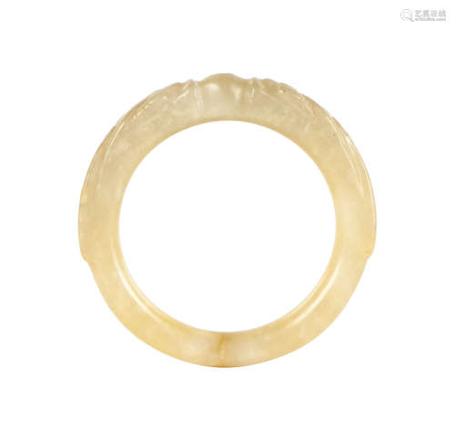 A CHINESE CARVED JADE DRAGON BANGLE