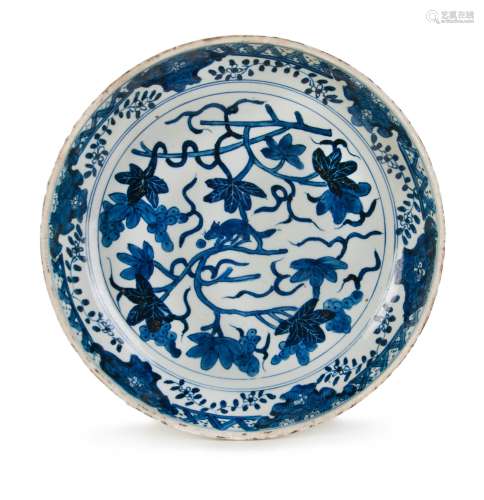 BLUE AND WHITE DISH BEAST ON A BRANCH