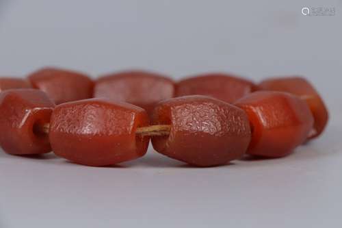 A STRING OF AGATE BRACELET