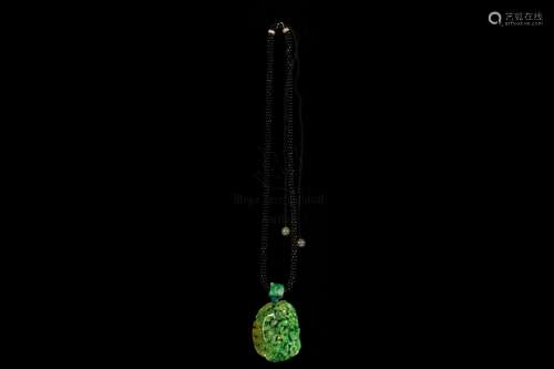 A CARVED JADEITE PENDANT WITH CERTIFIED