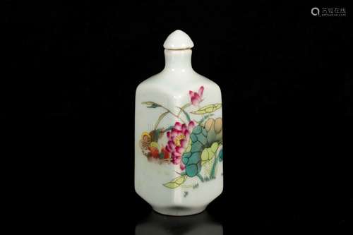 A FAMILLE ROSE MOLDED PORCELAIN SNUFF BOTTLE