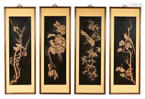 FOUR WOOD CARVED AND FRAMED 'FLOWERS AND BIRDS' PLAQUES