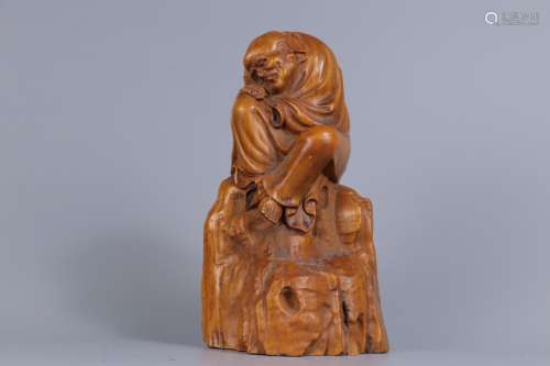 A CARVED BOXWOOD FIGURE OF SEATED LUOHAN